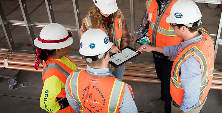 careers-benefits-group-reviewing-tablet-1a
